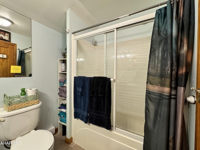 bathroom with toilet and a shower with door