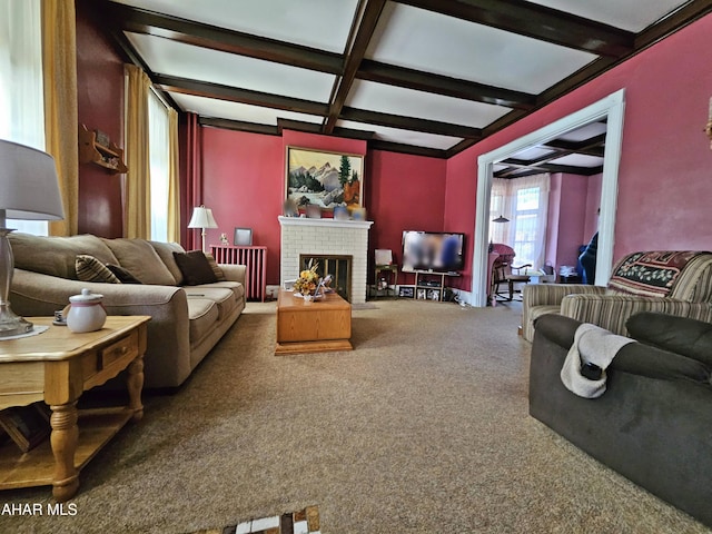 living area featuring a brick fireplace, coffered ceiling, carpet flooring, and beamed ceiling