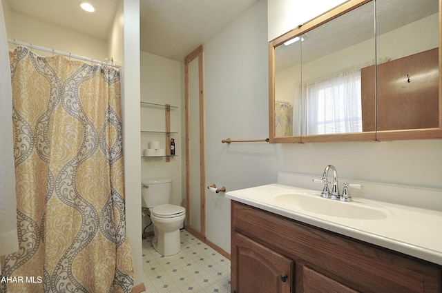 full bathroom featuring tile patterned floors, toilet, and vanity