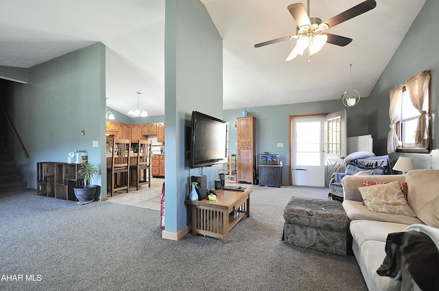 living area featuring light colored carpet, high vaulted ceiling, and ceiling fan