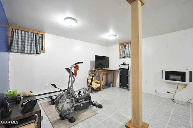 workout room featuring heating unit