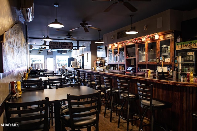 bar with hardwood / wood-style floors