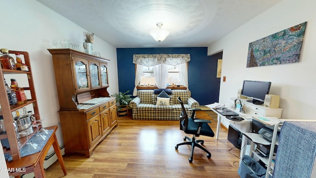 317 Tree Ln, Duncansville, PA 16635 - office space with a baseboard heating unit, a textured ceiling, and light wood-type flooring