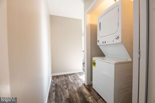 laundry room with baseboards, dark wood finished floors, laundry area, and stacked washing maching and dryer