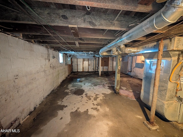 basement featuring heating unit