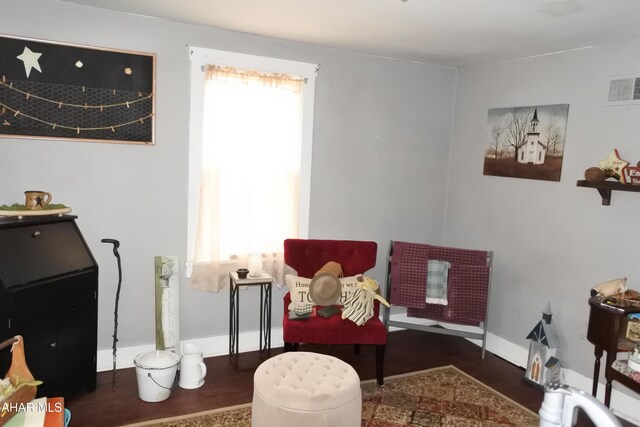 living area with dark wood-type flooring