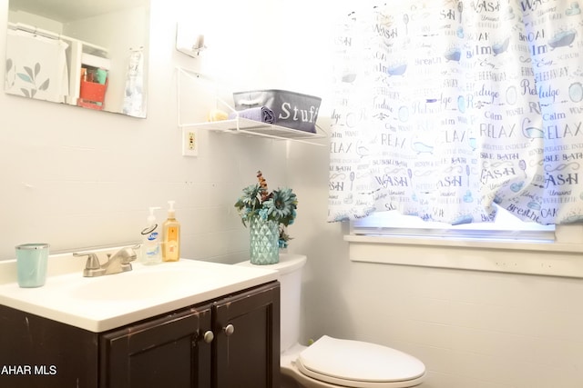 bathroom with vanity and toilet