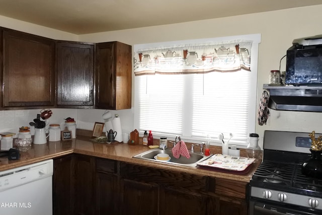 kitchen with black gas range, dishwasher, sink, dark brown cabinets, and exhaust hood