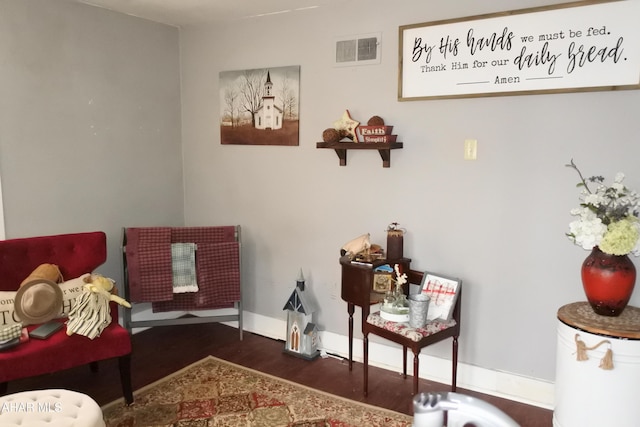 sitting room featuring dark hardwood / wood-style flooring