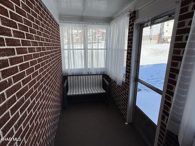 unfurnished sunroom with plenty of natural light