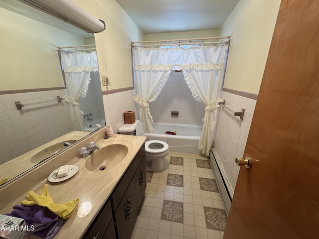 full bathroom featuring vanity, toilet, a baseboard radiator, and tile walls