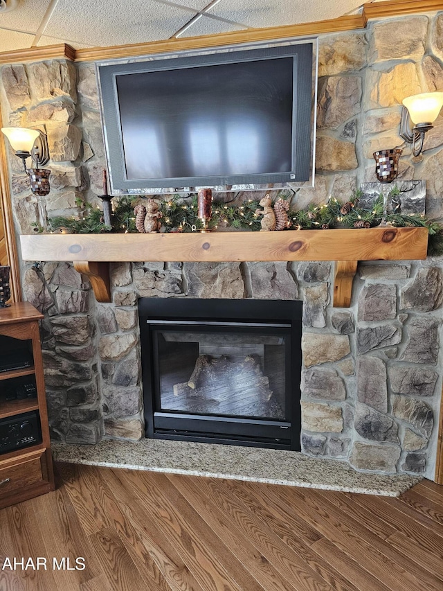 interior details featuring a stone fireplace