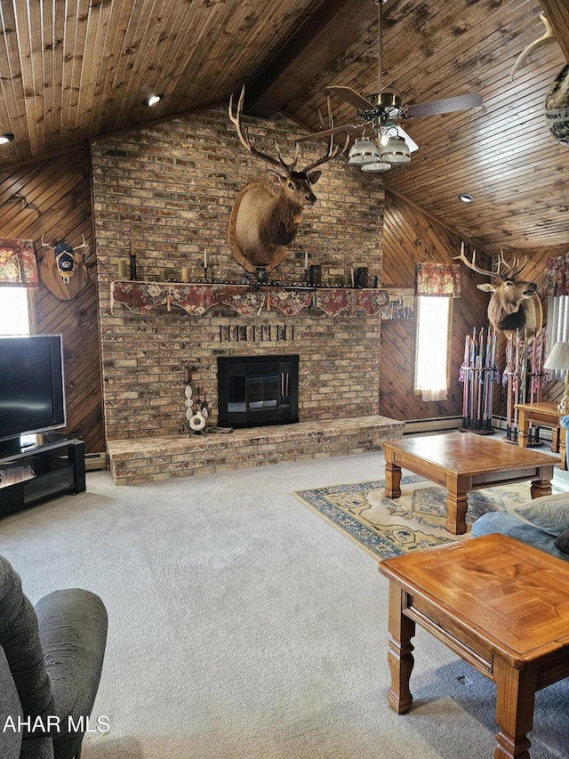 living room featuring carpet flooring, wood ceiling, a fireplace, and wood walls