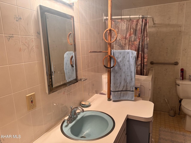 bathroom featuring a shower with curtain, vanity, tile walls, and toilet