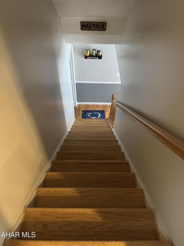 153 Frederick Rd, Altoona, PA 16602 - stairs featuring wood finished floors and baseboards