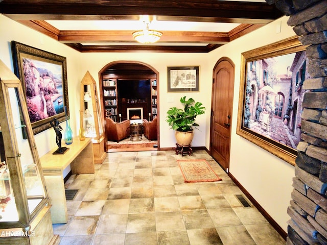 hallway featuring beamed ceiling