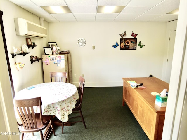 carpeted dining area with a wall mounted AC and a drop ceiling