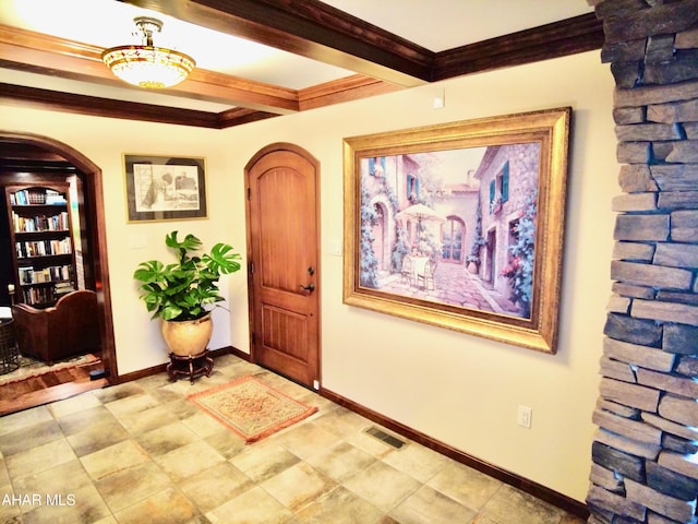 entryway with beamed ceiling and ornamental molding