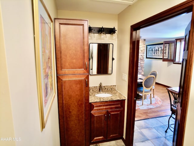 bathroom featuring vanity and hardwood / wood-style flooring