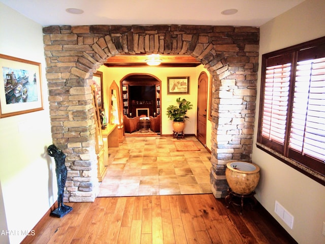 corridor with light hardwood / wood-style flooring