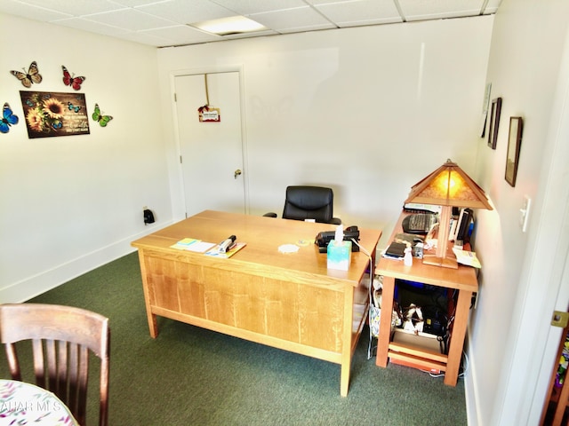 office area featuring a paneled ceiling and dark carpet