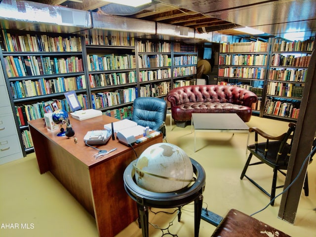 living area featuring concrete floors