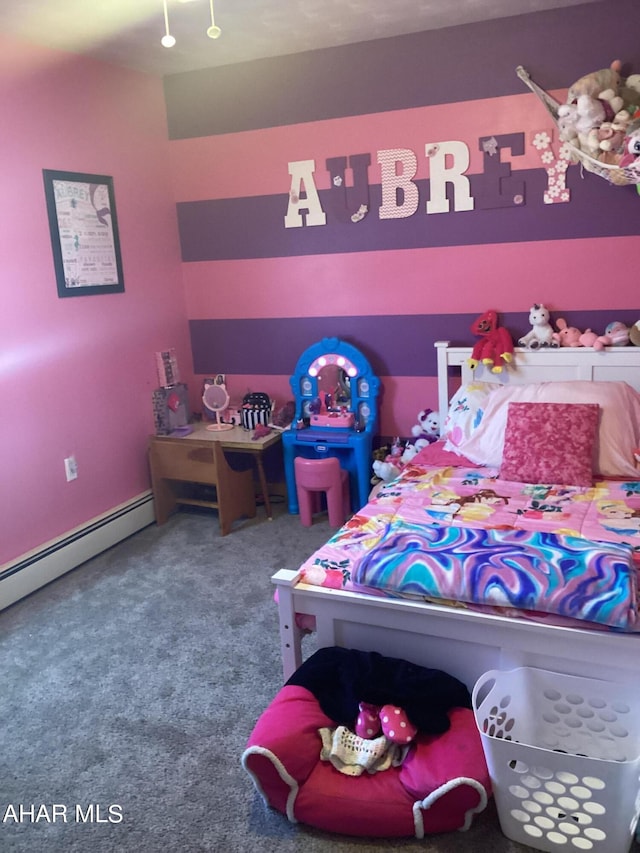 carpeted bedroom featuring a baseboard heating unit