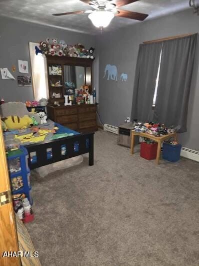 bedroom with carpet, ceiling fan, and baseboard heating