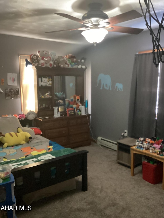 bedroom with ceiling fan, carpet floors, and a baseboard heating unit