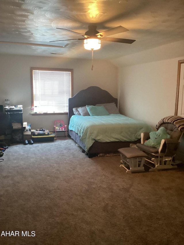 bedroom with ceiling fan and carpet floors