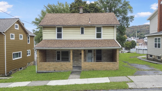 view of front facade with a porch and a front yard