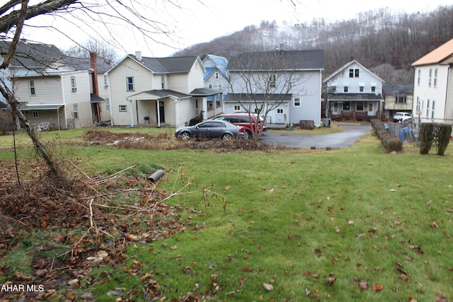 rear view of house with a lawn