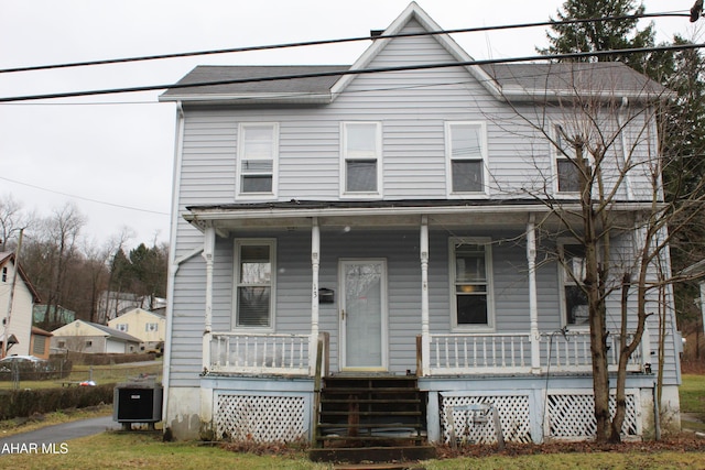 view of front of home featuring central AC unit and a porch