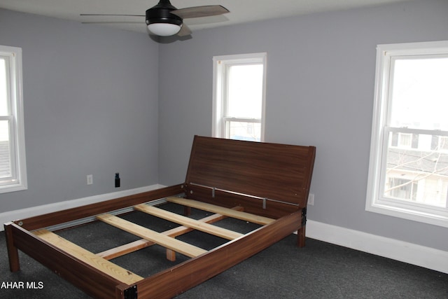 carpeted bedroom featuring ceiling fan