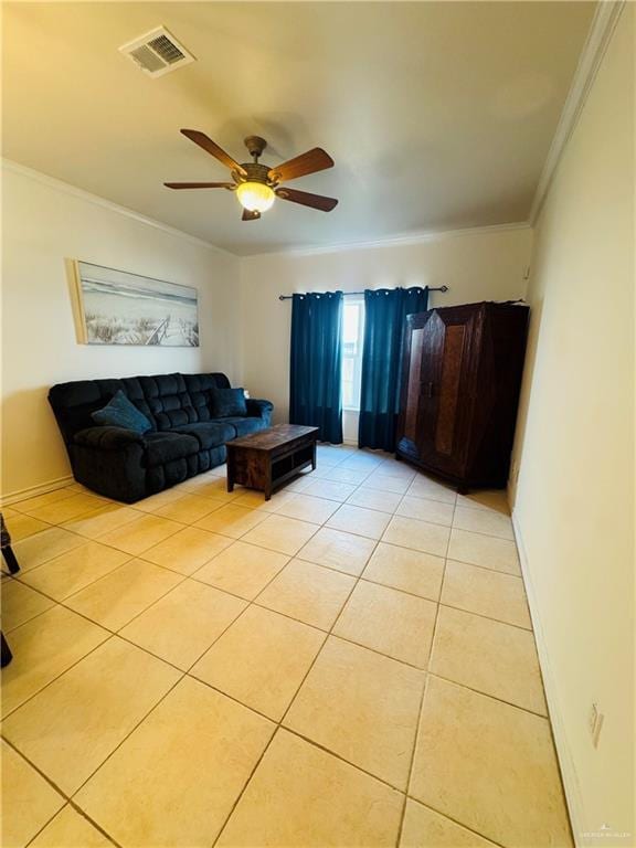 tiled living room with ceiling fan and crown molding