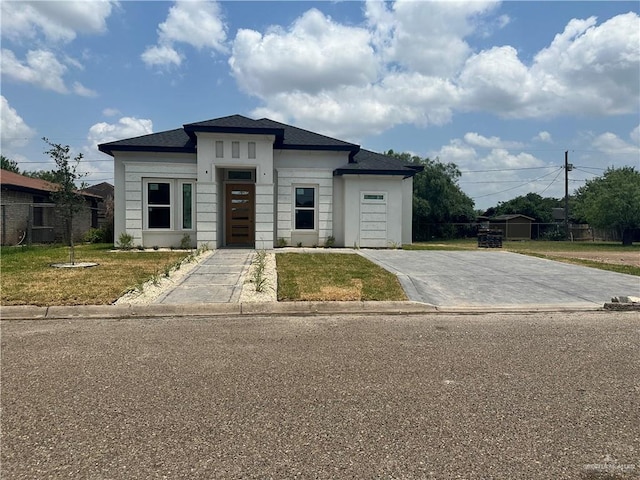 208 N Resplandor St, Mission, TX 78572 - prairie-style home featuring concrete driveway