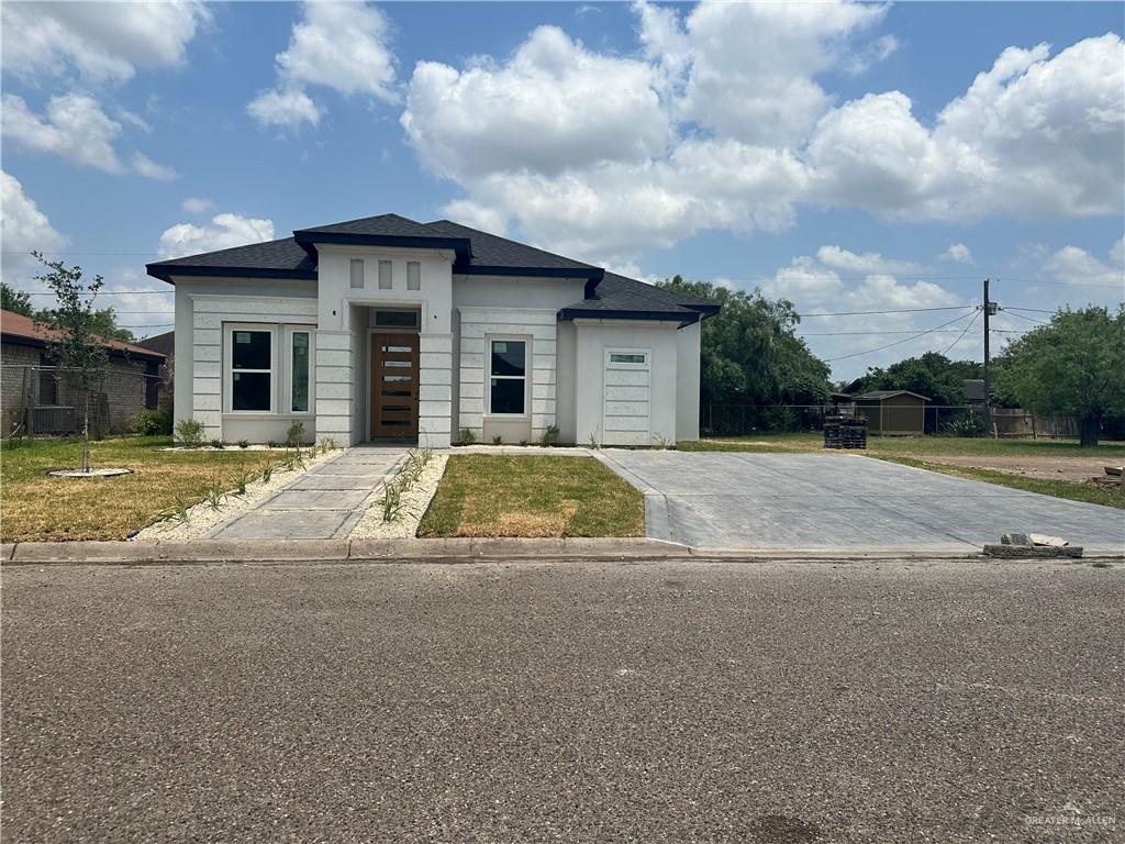 208 N Resplandor St, Mission, TX 78572 - view of front of house featuring roof with shingles