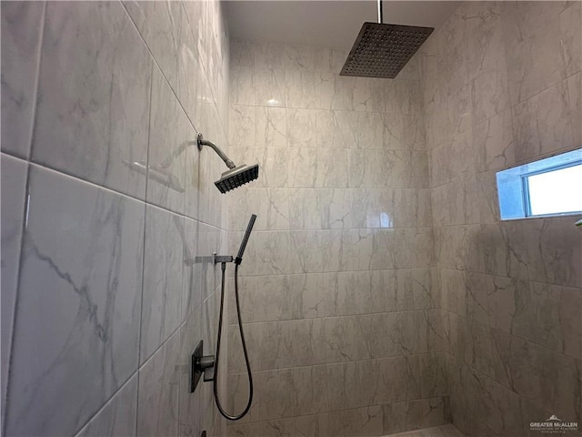 bathroom featuring tiled shower