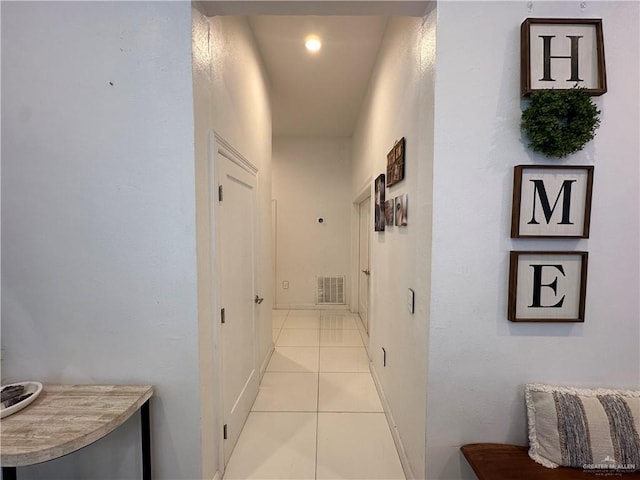 corridor with light tile patterned flooring