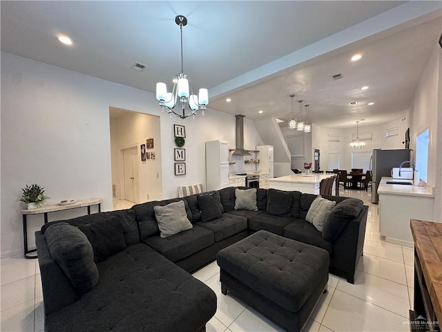 tiled living room featuring an inviting chandelier and sink