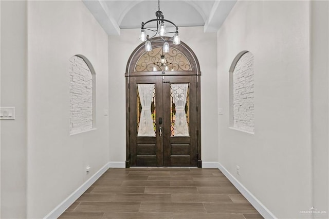 foyer entrance with french doors and hardwood / wood-style floors