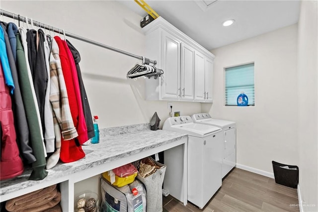 laundry room featuring cabinets and independent washer and dryer