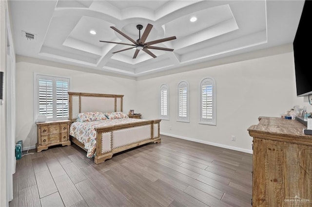 bedroom featuring hardwood / wood-style floors, ceiling fan, and coffered ceiling