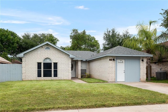 single story home with central air condition unit and a front yard