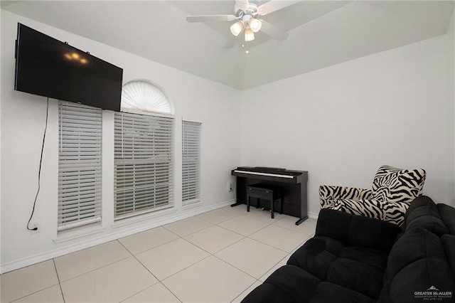 tiled living room with ceiling fan