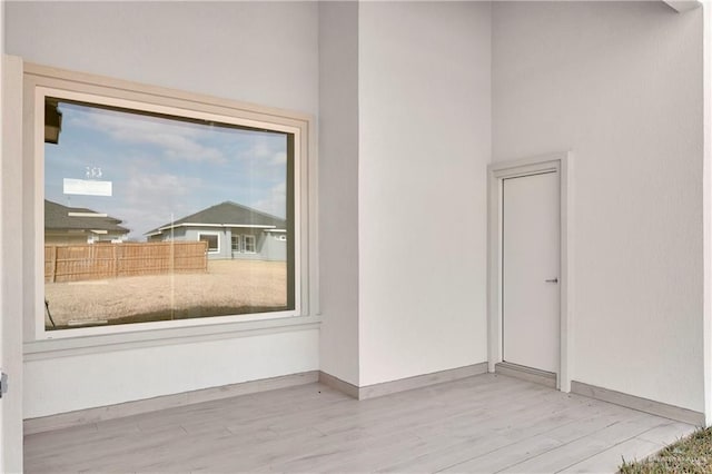 spare room featuring light hardwood / wood-style floors