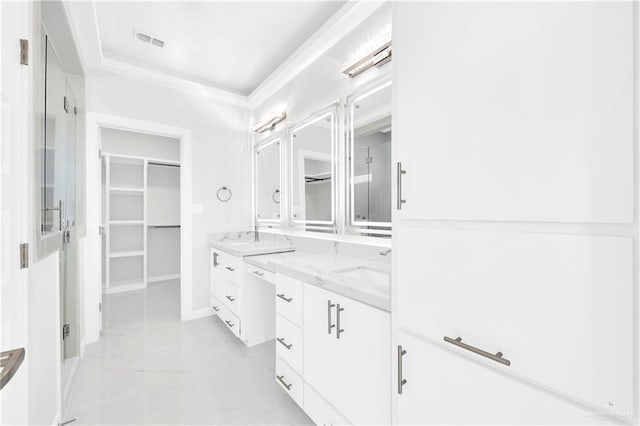 bathroom with vanity and crown molding