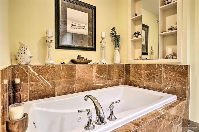 310A Padre Blvd, South Padre Island, TX 78597 - bathroom featuring built in shelves and tiled tub