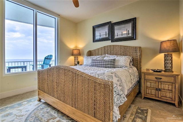 310A Padre Blvd, South Padre Island, TX 78597 - bedroom featuring access to exterior, ceiling fan, tile patterned flooring, and a water view