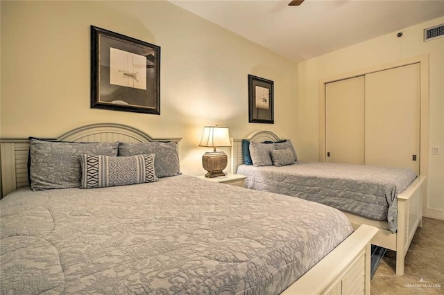 310A Padre Blvd, South Padre Island, TX 78597 - tiled bedroom featuring ceiling fan and a closet